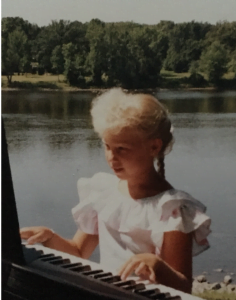 young Rachel playing piano